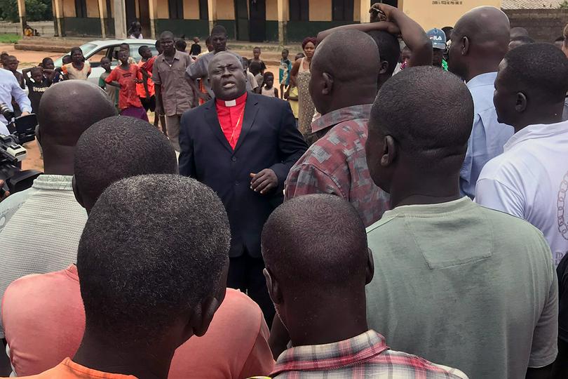 Nigeria Area Bishop John Wesley Yohanna (center) speaks to people at a camp for internally displaced persons in Jalingo, Taraba State, Nigeria, in 2019.