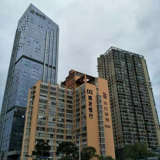 Jida Church sits on the 13th floor of a golden office building (middle) in Panlong District, Kunming City.