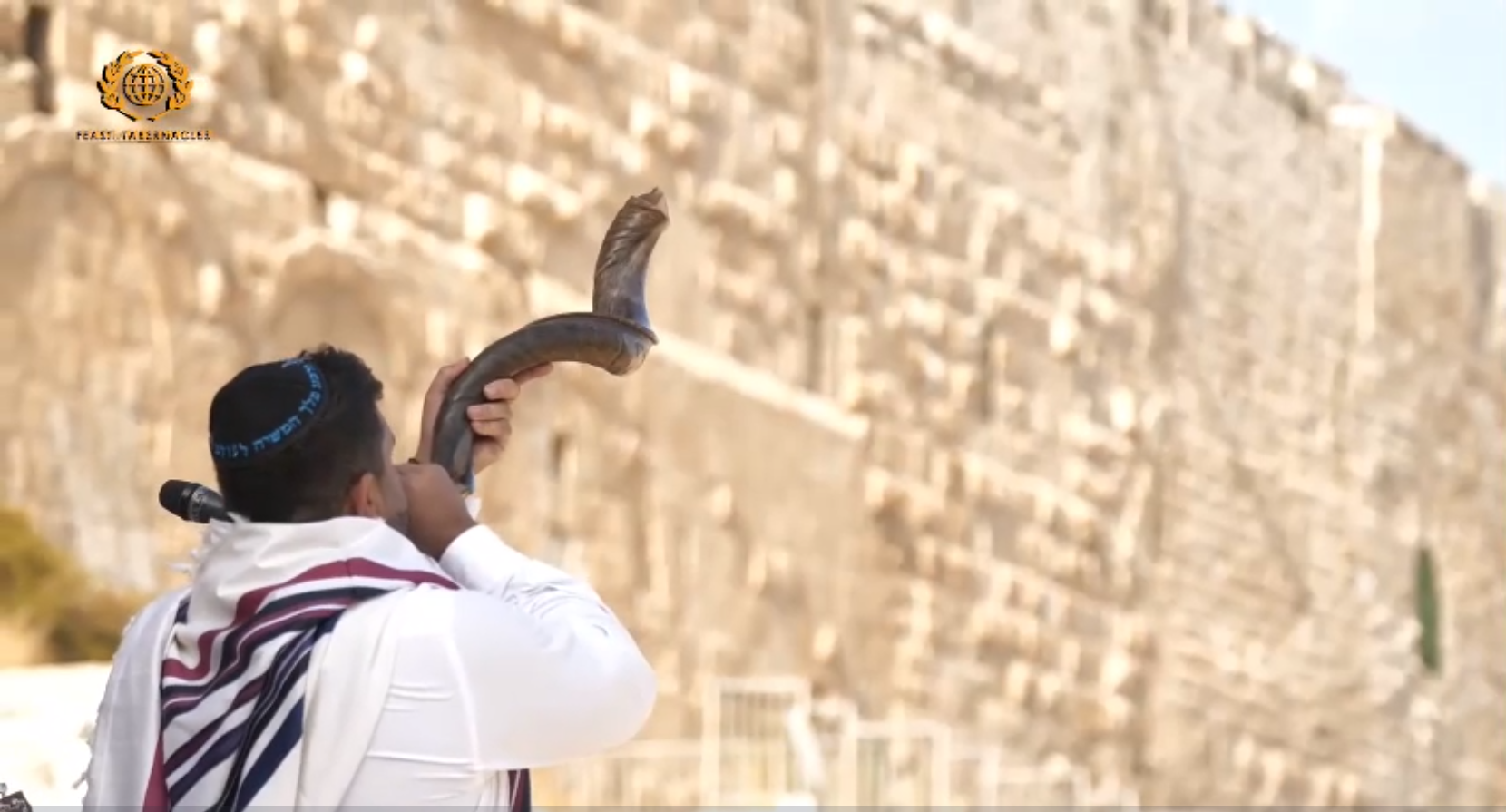 A man blew a shofar to begin the ingathering of the Nations in Jerusalem of the 42nd Sukkot celebration from the Southern Steps, Israel, on September 20, 2021.