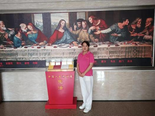 Wang Huilin took a picture beside a church offering box in Weinan, Shaanxi Province in September 2021.