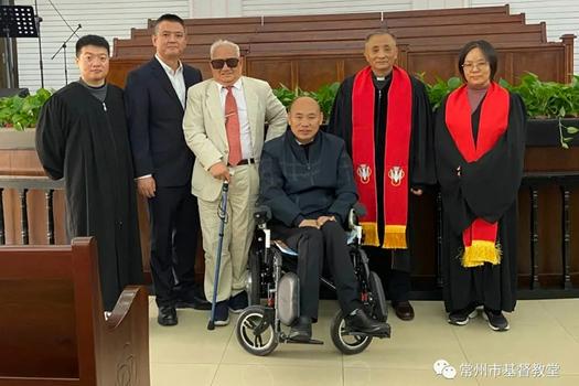 Two pastors and believers took a group picture after a baptism service was held in Changzhou Church, Changzhou, Jiangsu, on October 24, 2021.