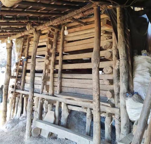 The picture of a wooden cage in which two male Christians with mental illness were locked