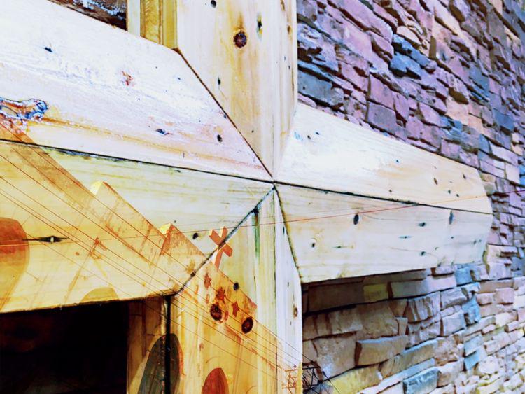 A wooden cross on a wall