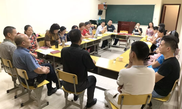 A picture shows a small group meeting under COVID-19 pandemic.