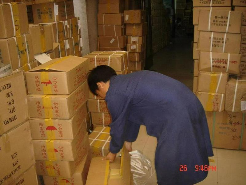 A picture shows a man unpacking relief supplies which were for the Sichuan Earthquake that occurred on May 12, 2008.