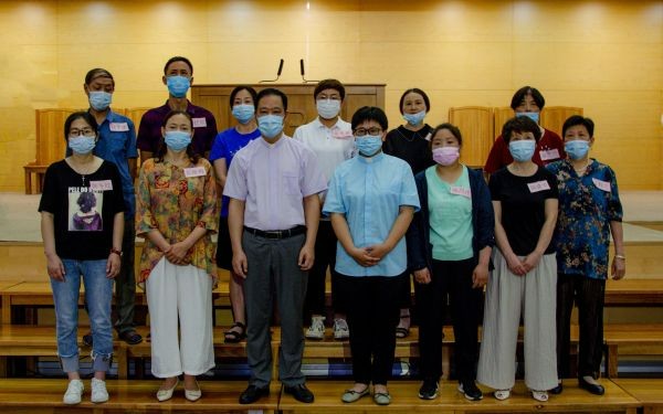 New believers and pastors of Xiangcheng Church in Suzhou, Jiangsu, took a group picture after the baptism conducted on July 10, 2022.