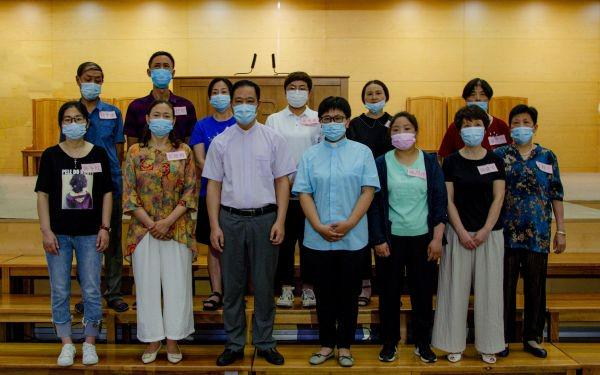 New believers and pastors of Xiangcheng Church in Suzhou, Jiangsu, took a group picture after the baptism conducted on July 10, 2022.