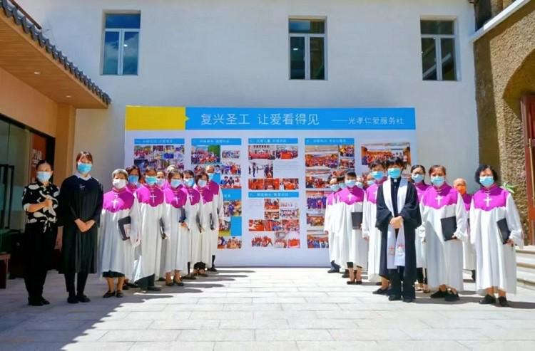 Pastors and the choir of Guangxiao Church in Guangzhou, Guangdong, took a group picture during a photo exhibition to show the church's charitable activities on August 7, 2022.