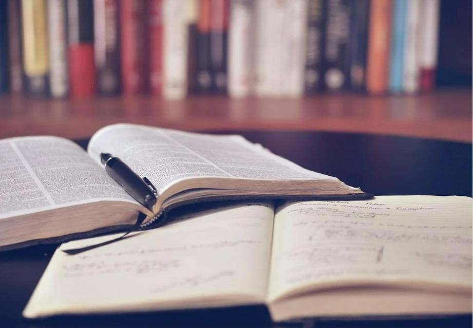 An open Bible and a book