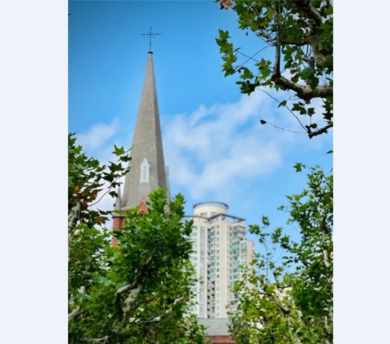 The soaring roof of Shanghai St. Ignatius Cathedral with a cross