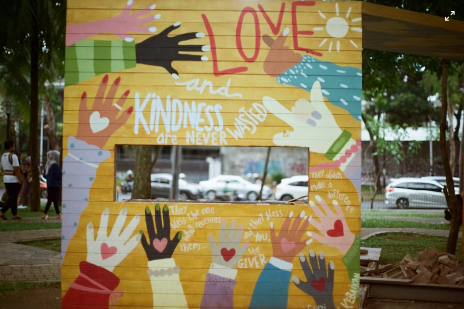 A picture with many palms printed with hearts