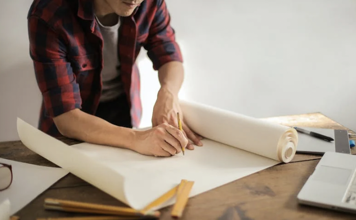 A picture shows a man drawing.