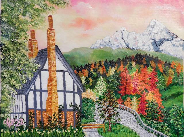 A picture of a house in a mountain forest