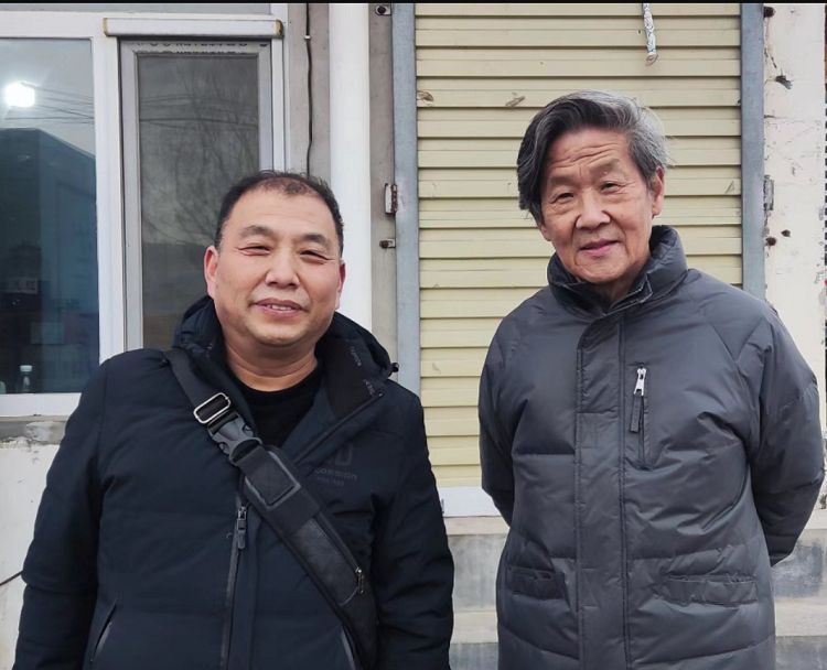 A picture of Rev. Niu Tianping (right) and the author