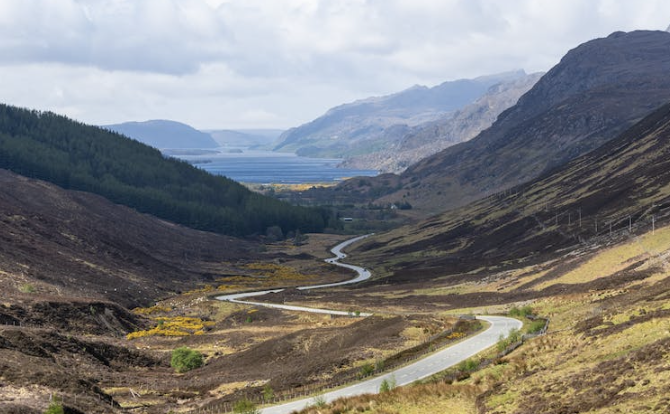 A picture of a winding road in the mountains.